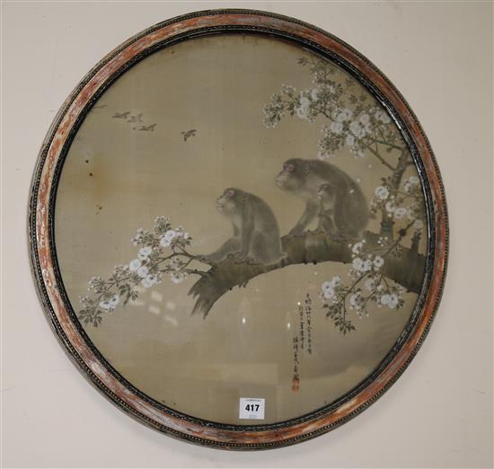 A Japanese watercolour on silk of two monkeys, Meiji period, 61cm diameter